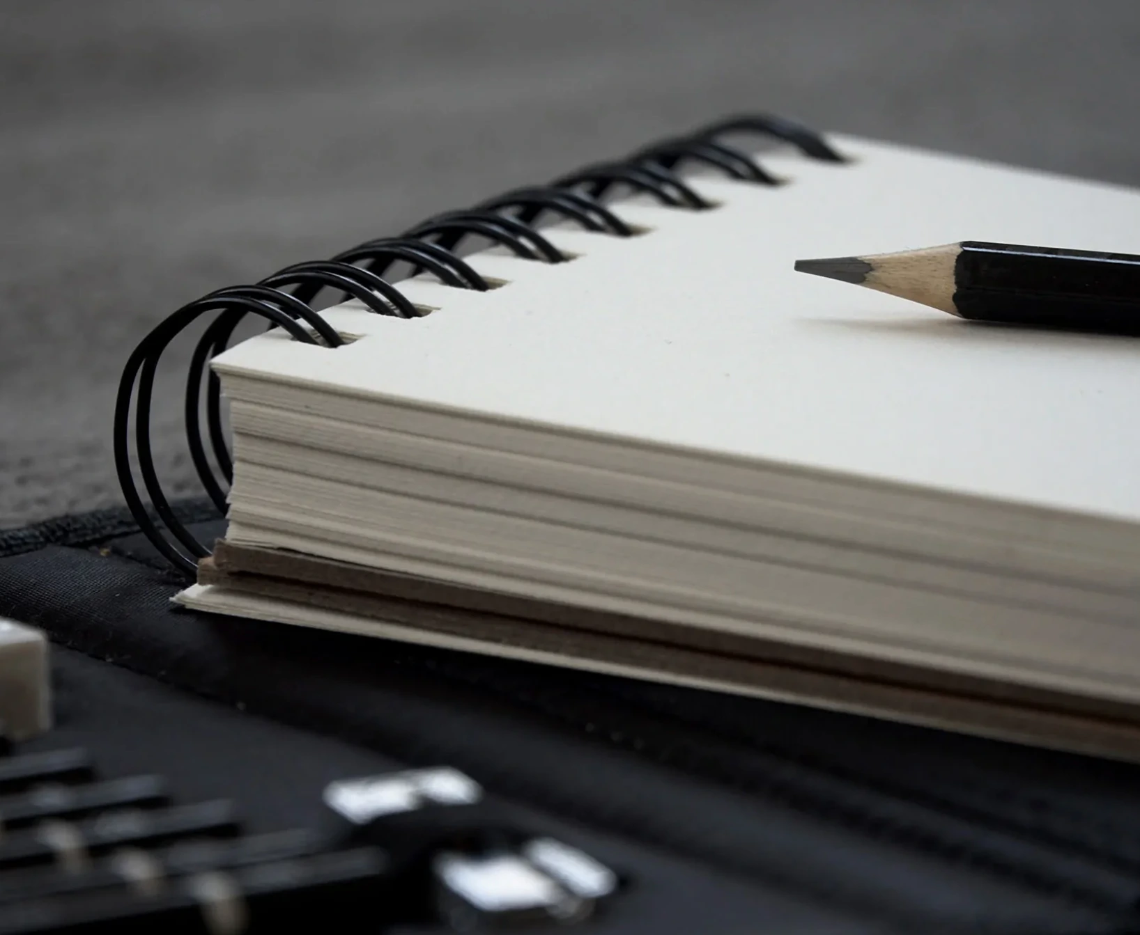 Spiral notepad with pencil – note-taking technique in consecutive interpreting